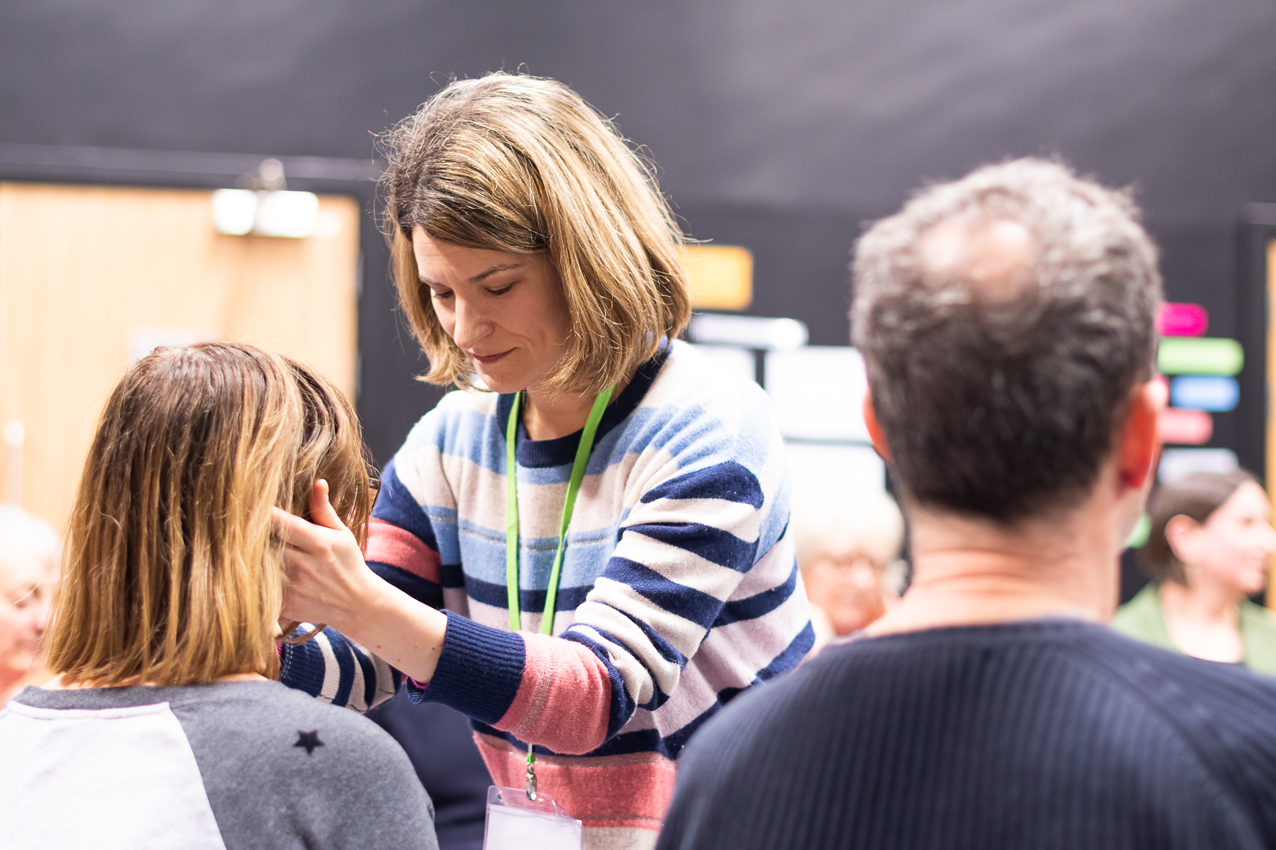 photo of Alexander teacher holding the head of a pupil